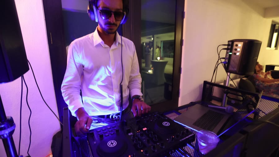 Sergio DJing a bilingual set at a Miami event
